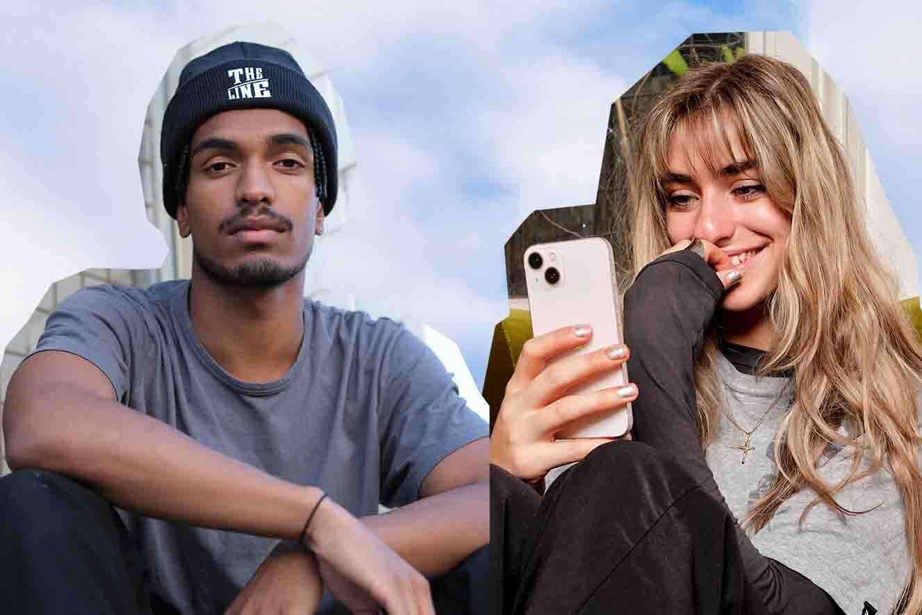 Background: Hazy, cloudy sky. Two people sitting outdoors; a female is holding a smartphone and laughing, the male is wearing a beanie and looking at the camera.