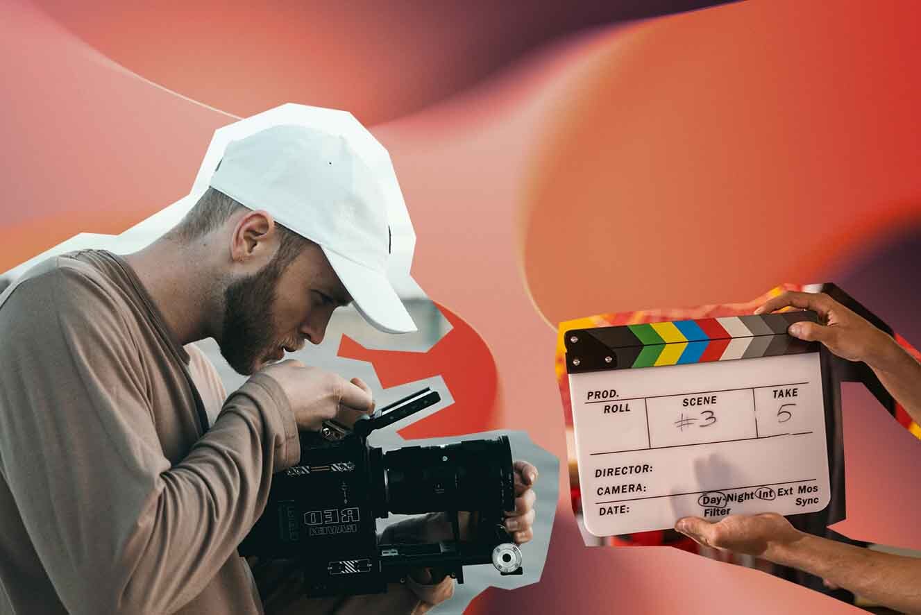 A young man wearing a white cap and green shirt is operating a video camera. Two hands holds a clapperboard, set against a dual-tone red and orange background.