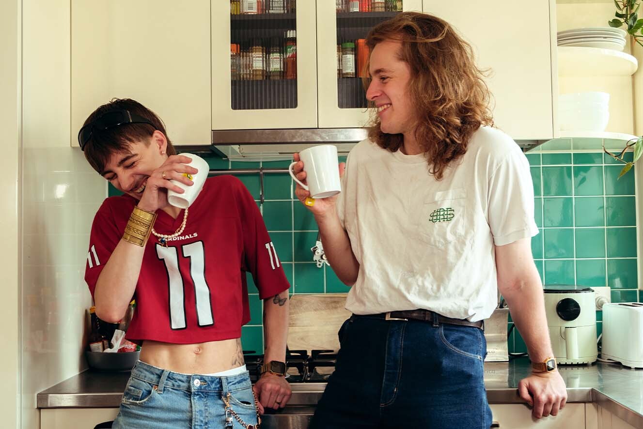 Two young men having a cup of tea. Two young men having a cup of tea.
