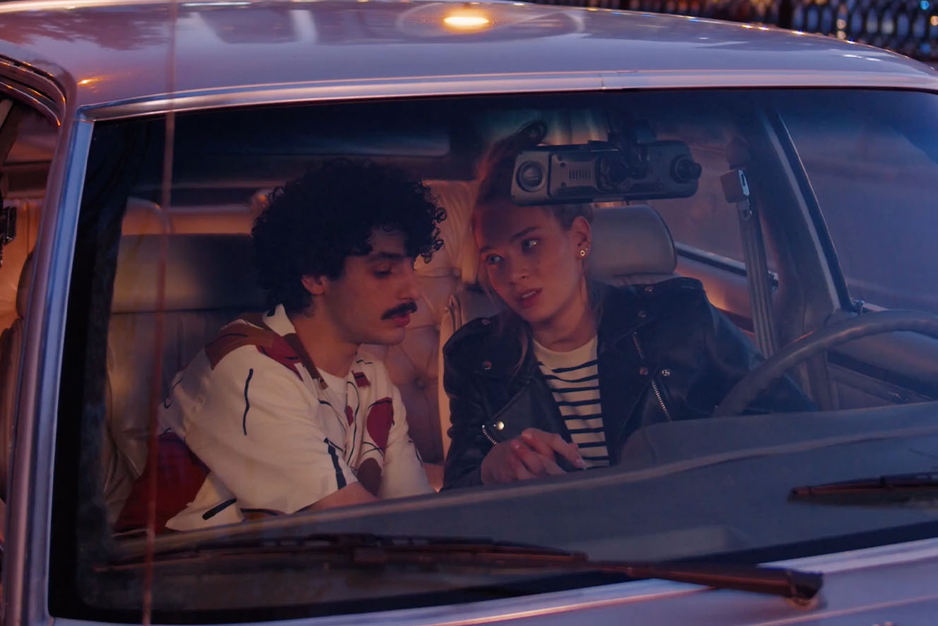 A young hetero couple in a car. A young hetero couple in a car.