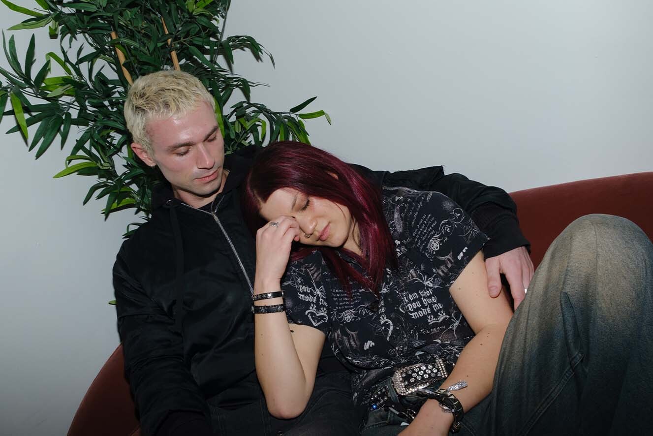 Young man consoling young woman.