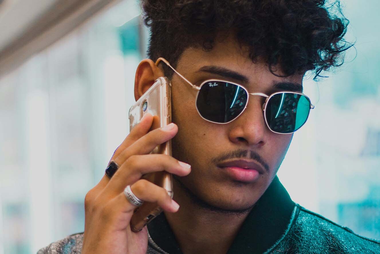 A young man on the phone. A young man on the phone.