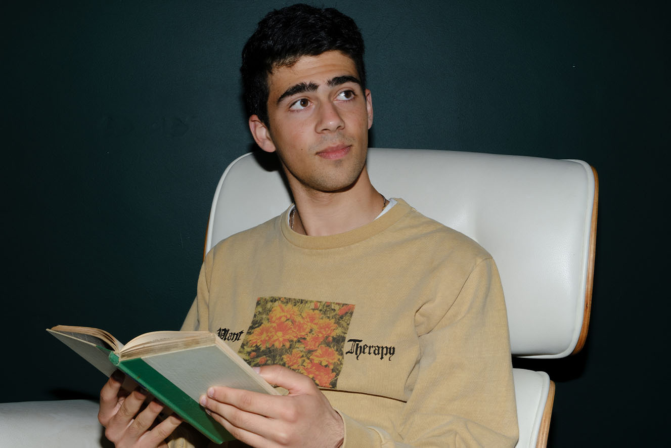 A young man reading a book. A young man reading a book.