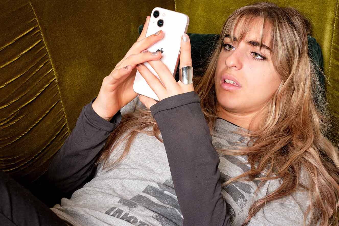 A young woman on the phone with a distressed look on her face. A young woman on the phone with a distressed look on her face.